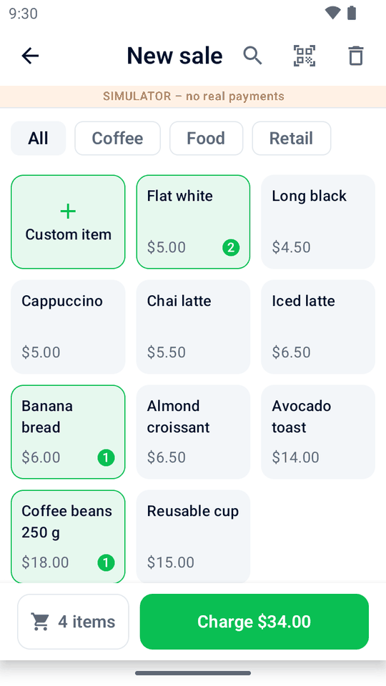 The sale screen with a grid of café products and a Charge $34.00 button